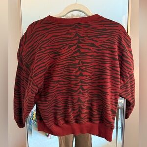 Burgundy and black tiger striped sweatshirt